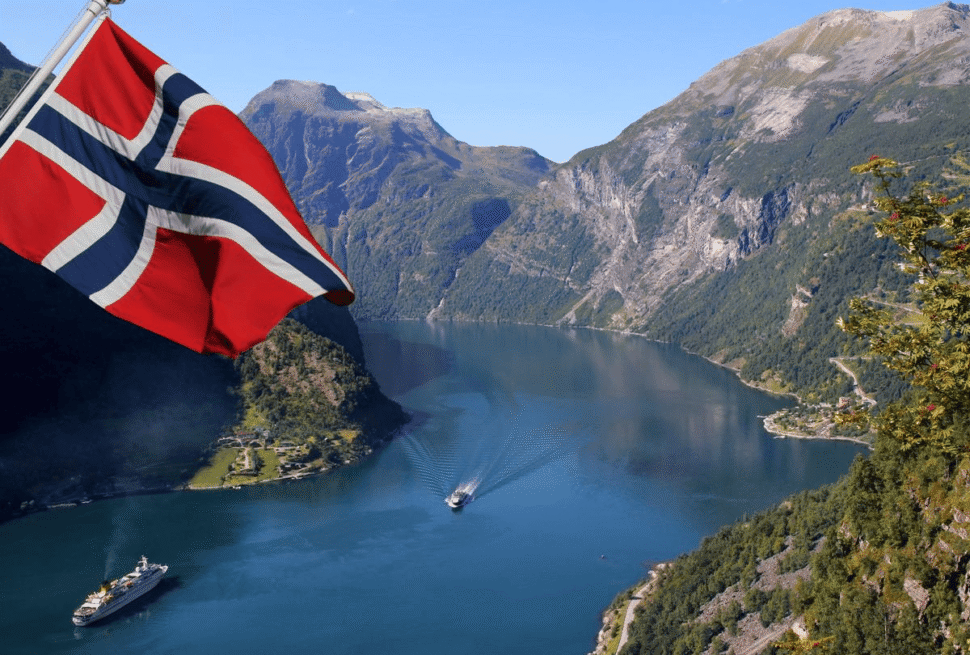 Passport with Schengen visa stamp representing easy approval for Norway visa from Dubai for travel across Norway and the Schengen zone.
