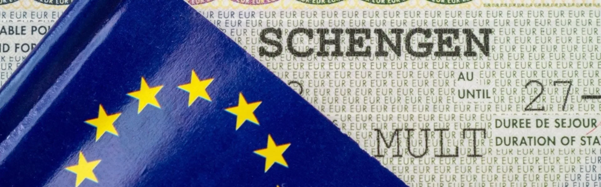 Passport with Norway Schengen visa stamp, ready for travel across Schengen countries.