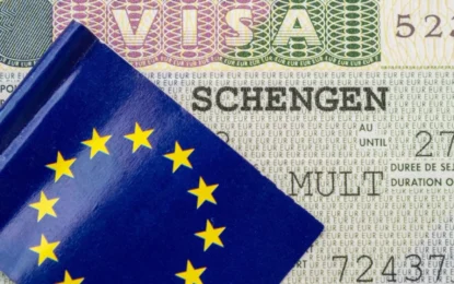 Passport with Norway Schengen visa stamp, ready for travel across Schengen countries.
