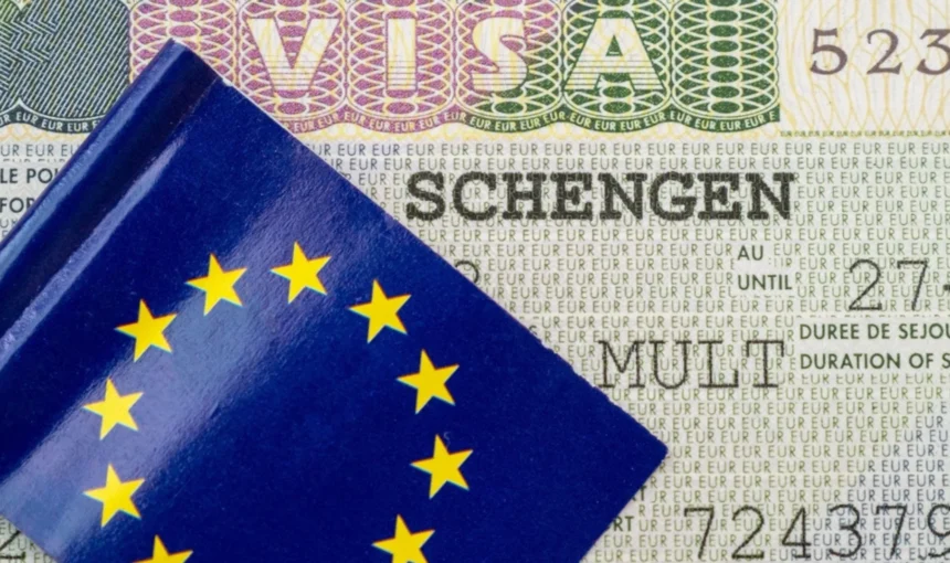 Norway Schengen Visa: Unlock This Dream Trip Now! › Forever Tourism LLC Passport with Norway Schengen visa stamp, ready for travel across Schengen countries.
