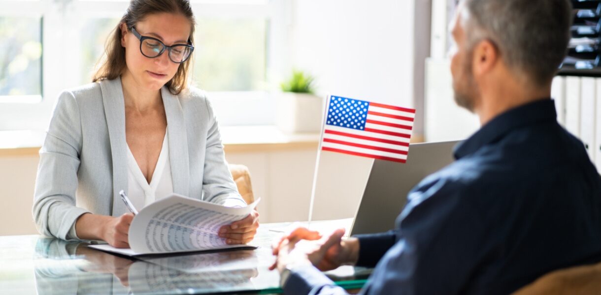 Person attending US visa application Dubai appointment at the embassy, preparing documents for US visa and US visa appointment.