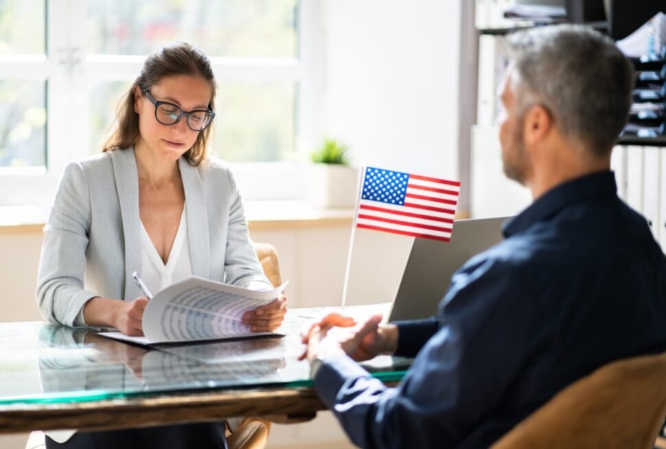 Person attending US visa application Dubai appointment at the embassy, preparing documents for US visa and US visa appointment.