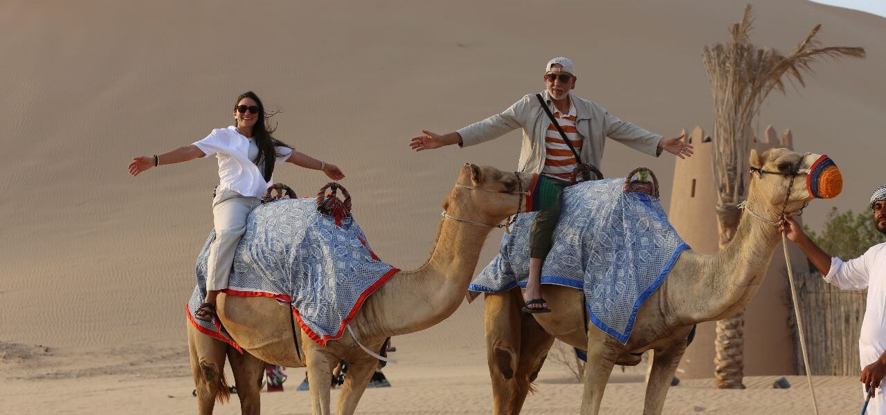 Dubai Desert Safari – This Wild Ride Will Blow Your Mind! › Forever Tourism LLC Tourists enjoying a thrilling Dubai Desert Safari with top Desert Safari Dubai Deals during an adventurous Dubai desert tour experience.