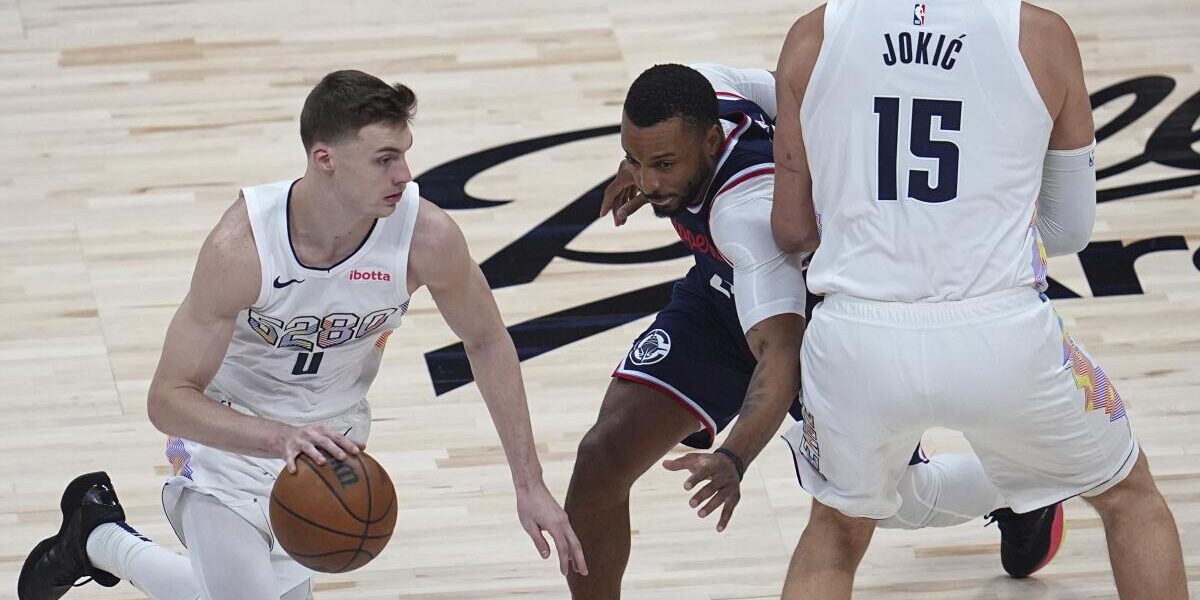 Fans cheering at the Clippers vs Nuggets game — get your US visa to experience the next Nuggets Clippers showdown in person.