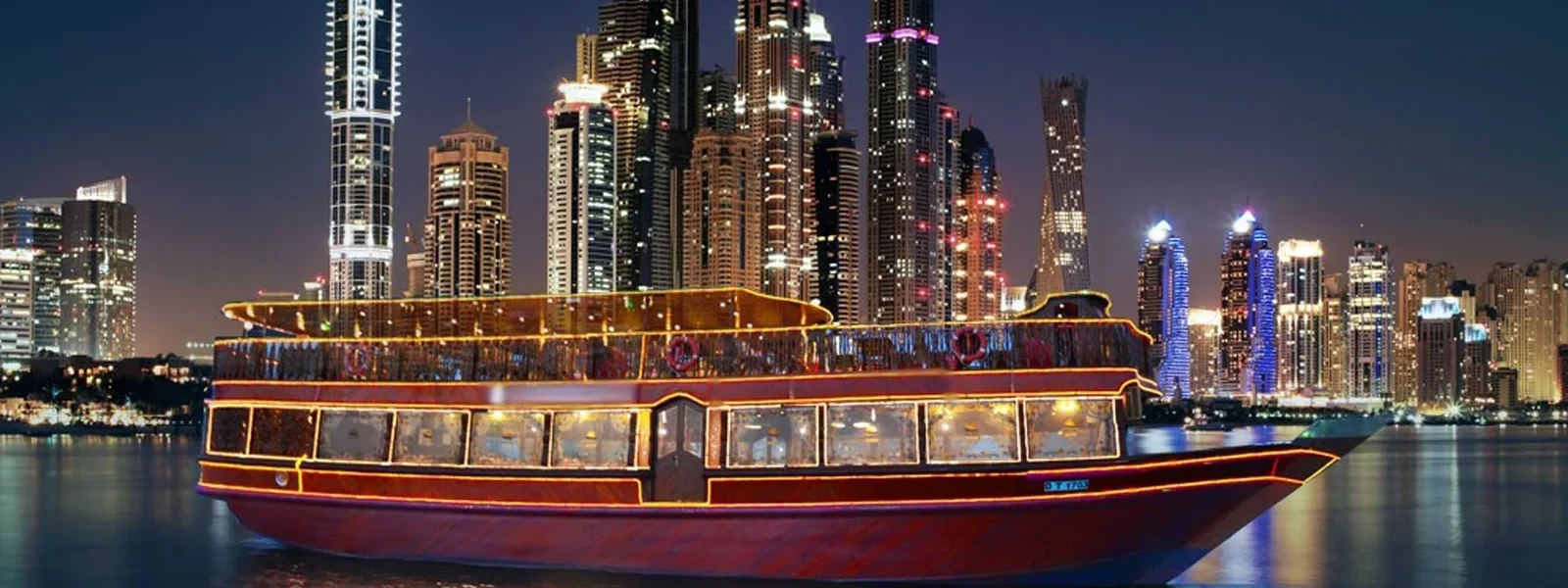 Experience an enchanting dhow cruise along Dubai Marina with a delicious dinner, live entertainment, and panoramic city views on a traditional wooden boat.