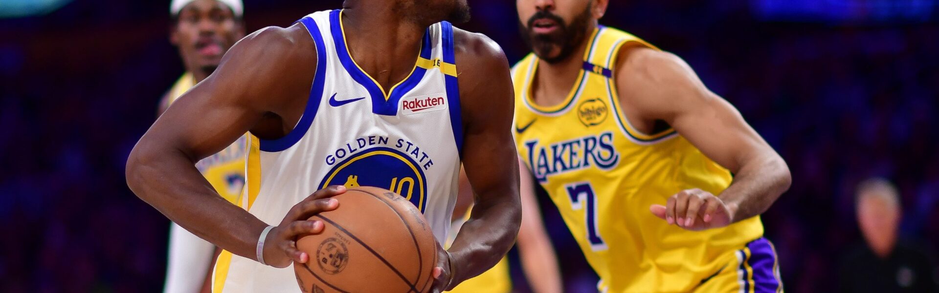 Fans cheering during the intense Lakers vs Warriors game – secure your USA visa to catch the next live NBA battle.