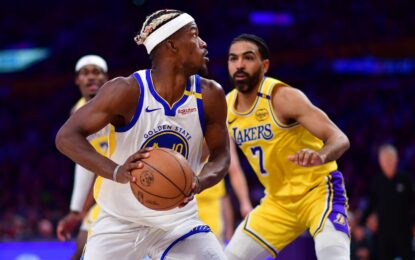 Fans cheering during the intense Lakers vs Warriors game – secure your USA visa to catch the next live NBA battle.
