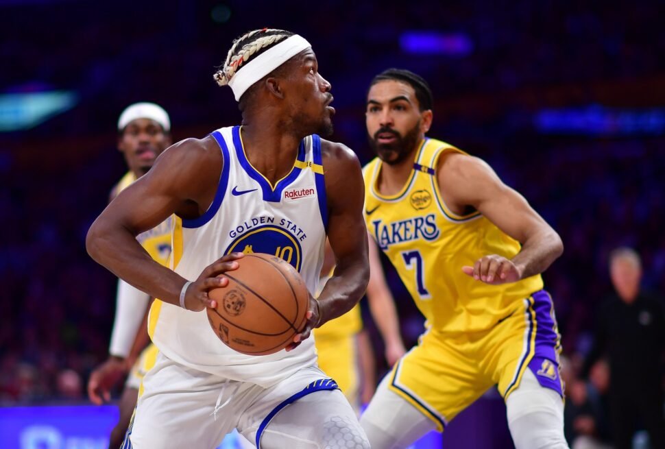 Fans cheering during the intense Lakers vs Warriors game – secure your USA visa to catch the next live NBA battle.