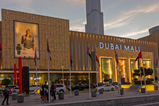 Dubai City Tour – Top 5 Spots to Explore Now › Forever Tourism LLC Dubai city tour showcasing Dubai Mall, desert safari adventures, and highlights from an exciting Dubai half day city tour with exclusive packages.