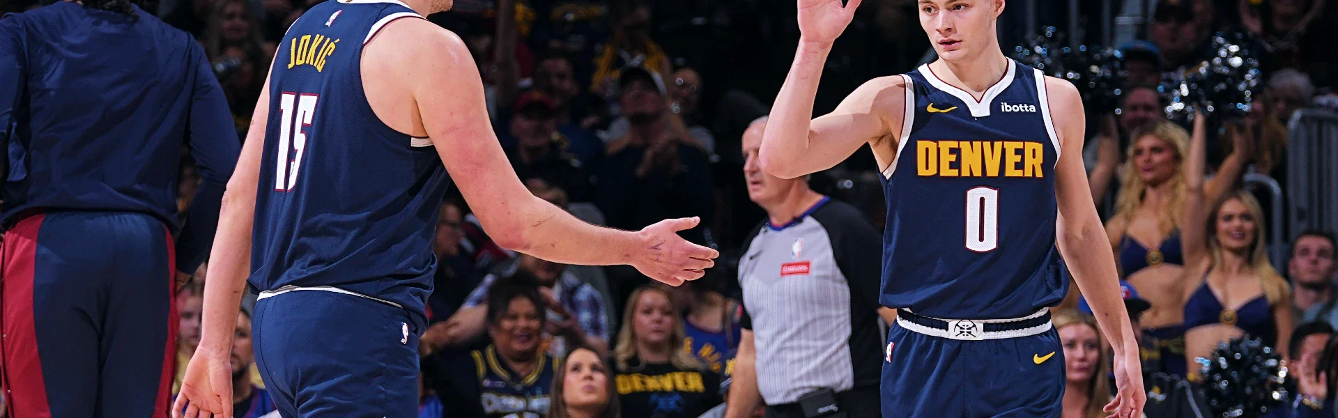 Grizzlies vs Nuggets game action in a packed USA arena during an intense Memphis Grizzlies basketball match.