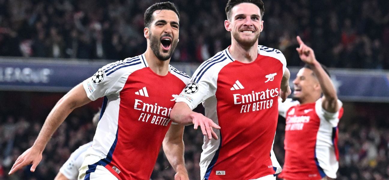 Fans cheering during the Arsenal vs Real Madrid Champions League match – a classic clash between Arsenal F.C. vs Real Madrid.