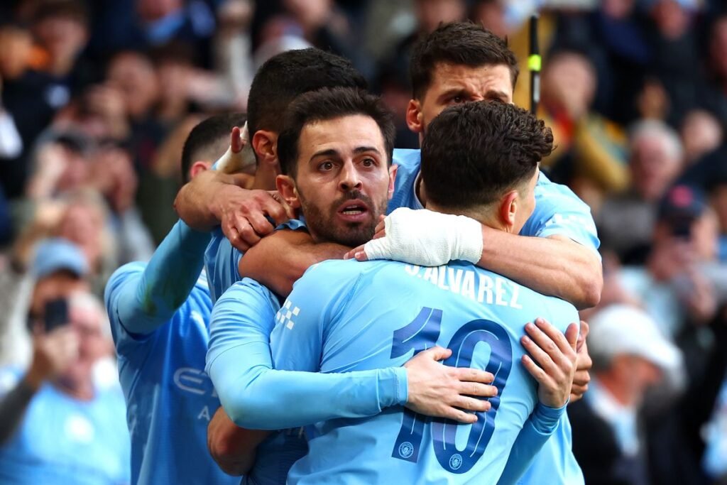 Man City vs Wolves Done! Want Next? Get Your Visa › Forever Tourism LLC Fans cheering at the Man City vs Wolves match, capturing the excitement of Premier League action in the UK.