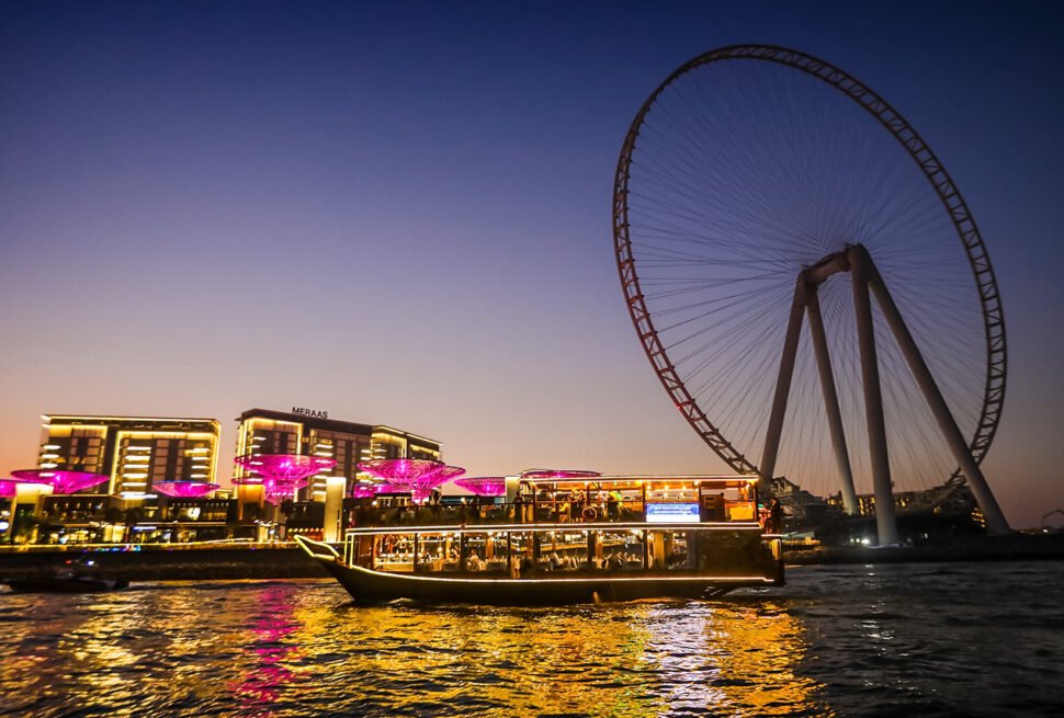 Traditional dhow sailing on a Dubai Marina Dhow Cruise with skyline views and evening lights.