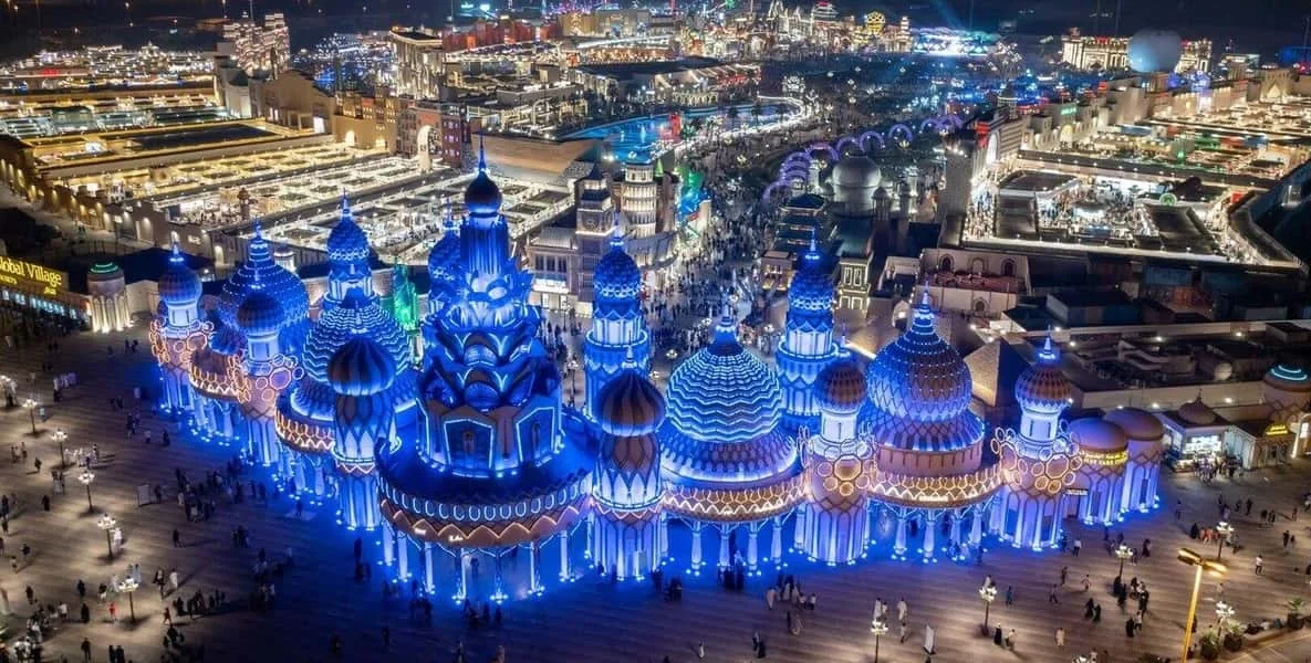Colorful Global Village 2025 rides with crowds enjoying the attractions before the Global Village Dubai closing date 2025.