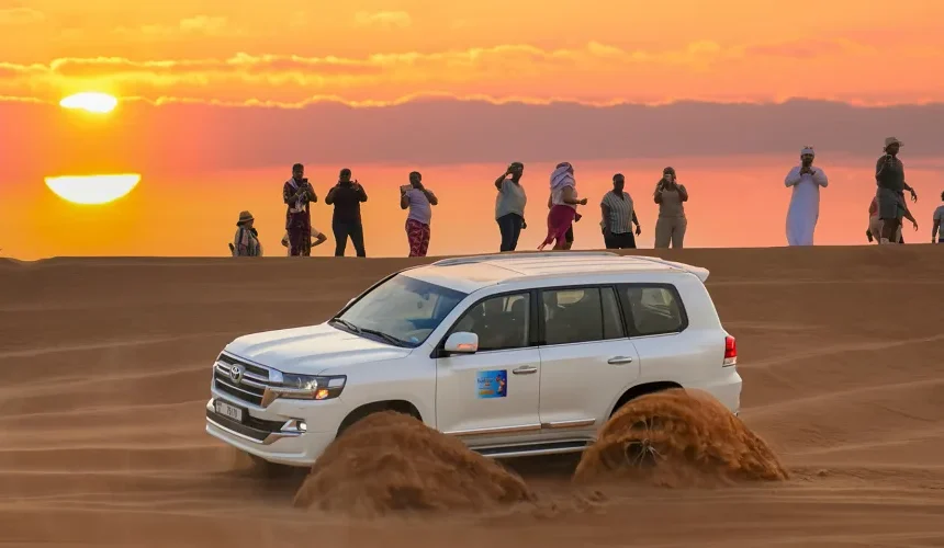 Dubai Desert Safari: Top Family Adventure in 2025! › Forever Tourism LLC Family enjoying camel ride during a Dubai desert safari adventure in the golden sand dunes.