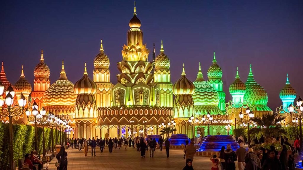 Crowds enjoying cultural shows and attractions at Global Village Dubai 2025 before the closing date, with festive lights and vibrant market stalls.