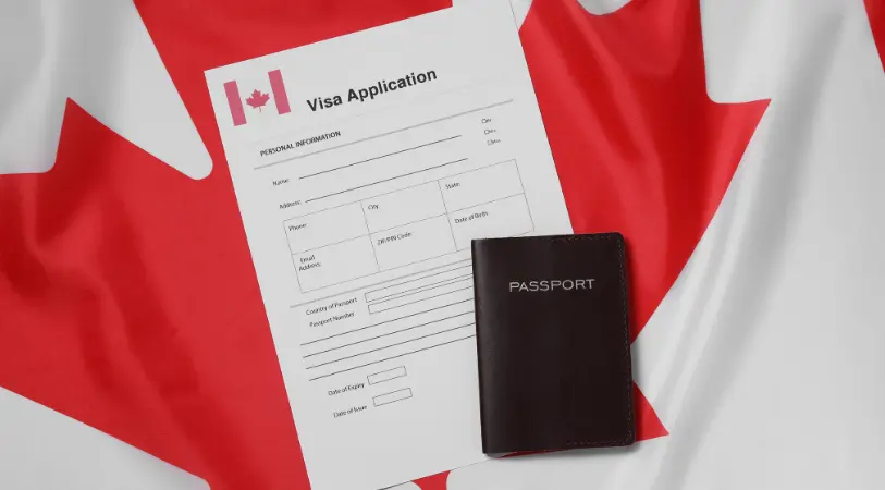 Canada Visa From Dubai: Fast Process, No Delays! › Forever Tourism LLC Passport and travel documents for Canada Visa From Dubai showing Canada visa requirements for UAE residents and tourist visa guidelines.
