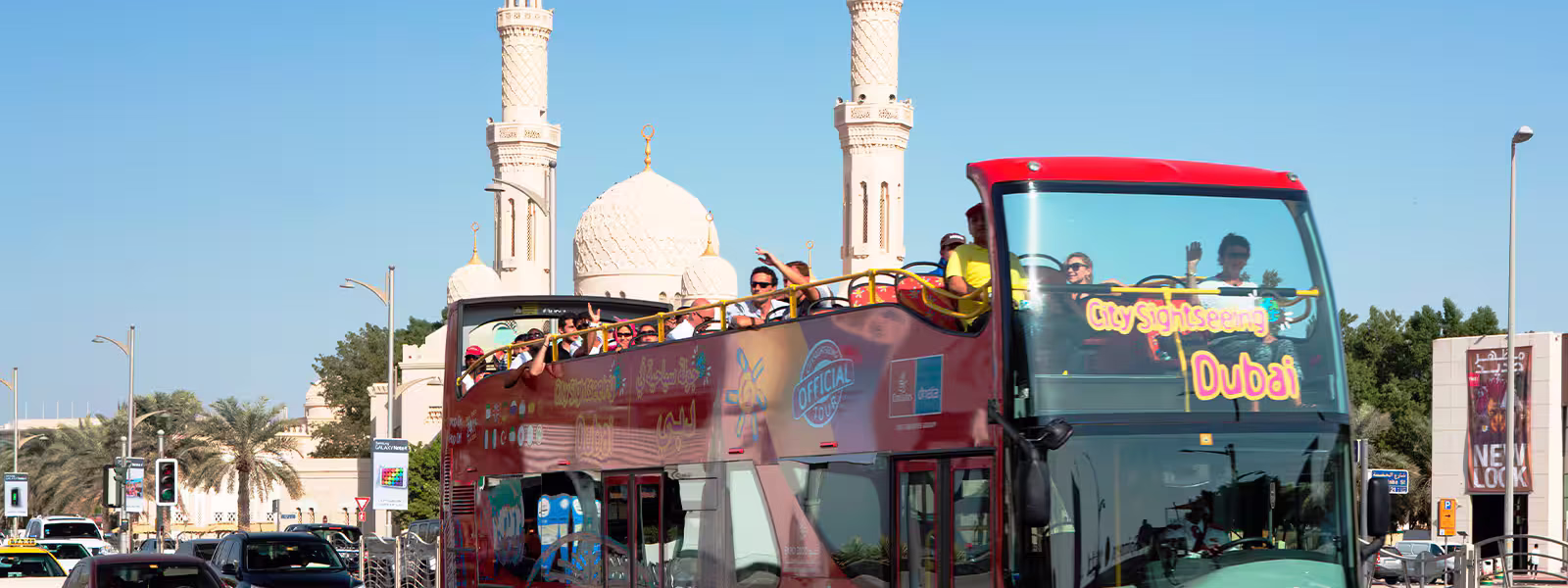 Tourists enjoying a Dubai City Tour with panoramic views from Burj Khalifa and thrilling moments during a Dubai Desert Safari adventure.