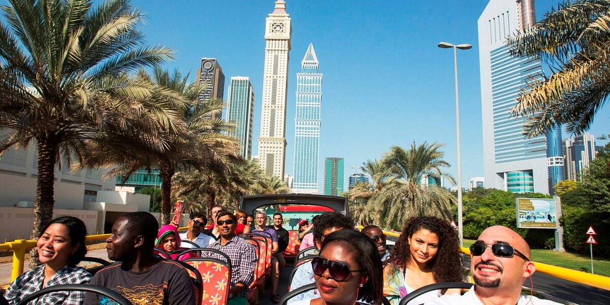 Tourists enjoying a Dubai City Tour with highlights like the Museum of the Future, Burj Khalifa, and thrilling Desert Safari Dubai.