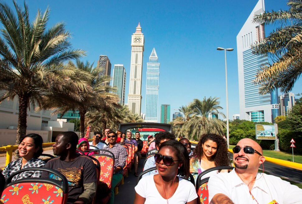 Tourists enjoying a Dubai City Tour with highlights like the Museum of the Future, Burj Khalifa, and thrilling Desert Safari Dubai.