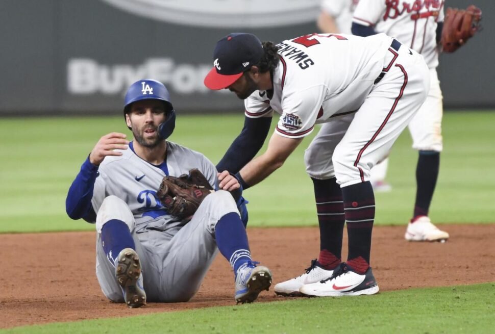 Fans cheering during the intense Dodgers vs Braves game between the Atlanta Braves and Los Angeles Dodgers.