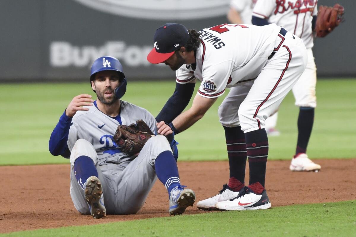 Fans cheering during the intense Dodgers vs Braves game between the Atlanta Braves and Los Angeles Dodgers.