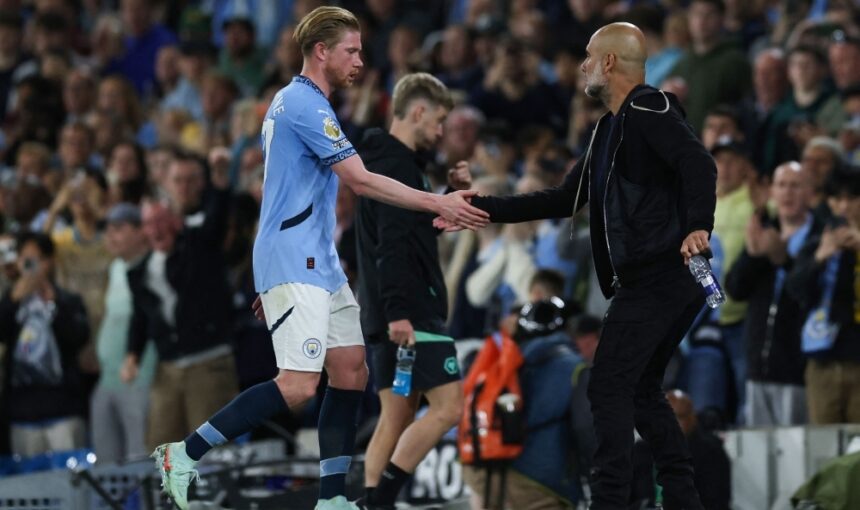 Fans cheering at the Man City vs Wolves match, capturing the excitement of Premier League action in the UK.