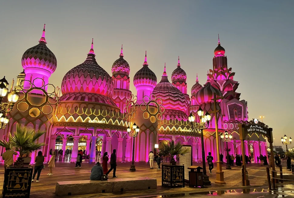 Visitors exploring Global Village Dubai at sunset, enjoying cultural pavilions and entertainment on the last day of Global Village 2025 with a ticket offer.