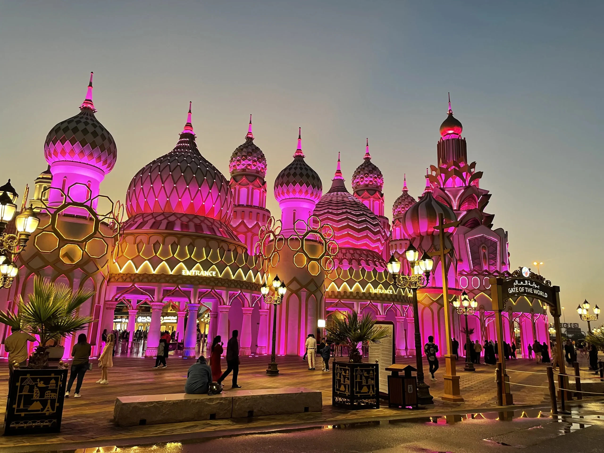 Visitors exploring Global Village Dubai at sunset, enjoying cultural pavilions and entertainment on the last day of Global Village 2025 with a ticket offer.