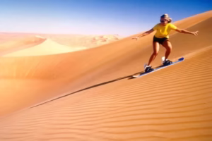 Tourists enjoying dune bashing during an evening desert safari Dubai as part of a thrilling desert safari Dubai UAE and Dubai safari desert tour.