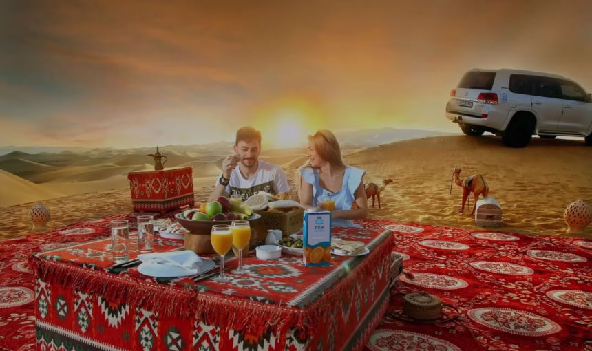 Tourists enjoying morning desert safari Dubai with camel ride and dune bashing in golden Dubai desert landscape.