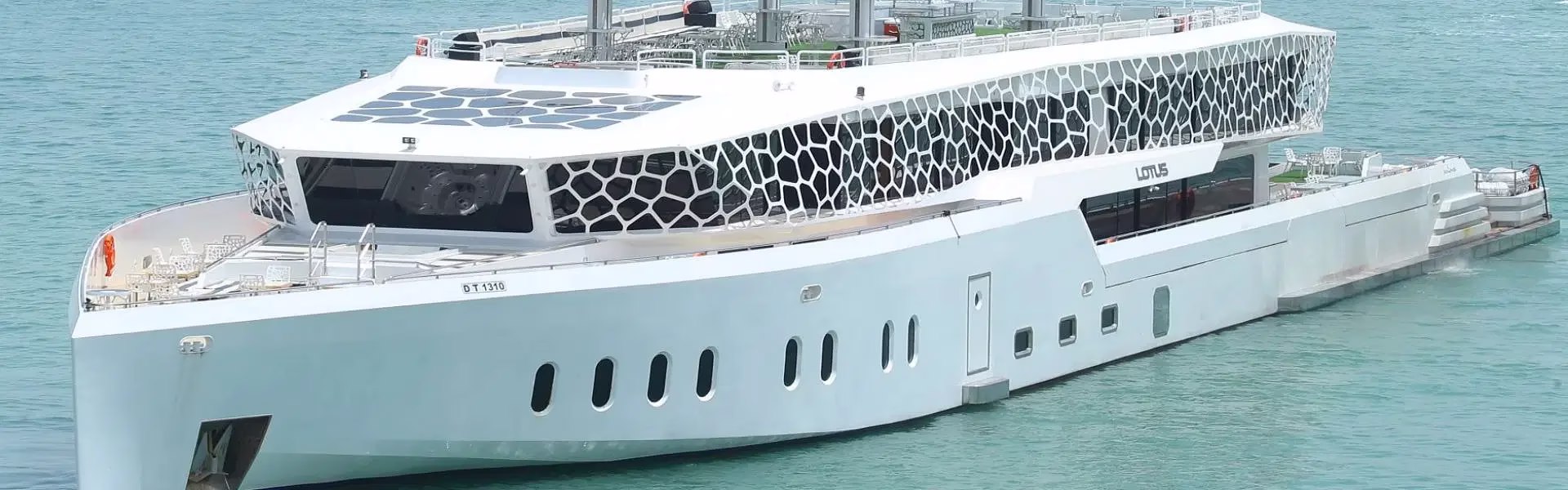 Lotus Dinner Cruise Dubai – No Booking Drama, 100K+ Love It › Forever Tourism LLC Guests enjoying a luxurious Lotus Dinner Cruise Dubai on the Lotus Mega Yacht with skyline views and elegant dining setup.