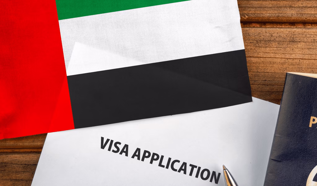 Dubai Tourist Visa: No Surprise Fees, Just Fast Approvals › Forever Tourism LLC Traveler reviewing documents and passport, preparing for a Dubai tourist visa application, checking how to get tourist visa for Dubai and required documents.