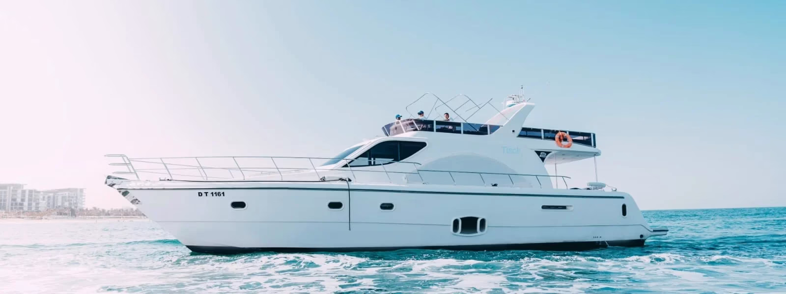 People enjoying a luxury yacht tour Dubai with scenic skyline views during a yacht trip Dubai.