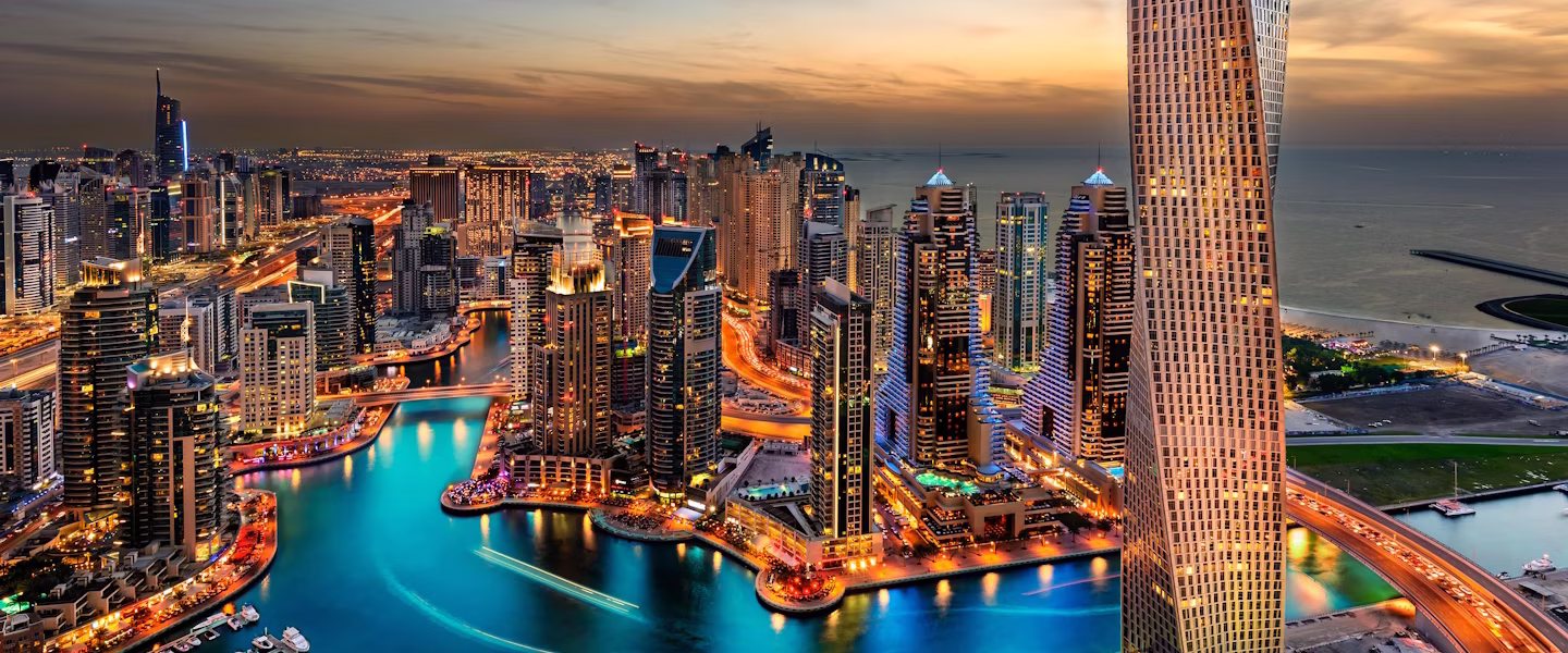 Tourists enjoying a Dubai day tour with views of iconic Dubai sightseeing landmarks, holding Dubai attractions tickets and following a planned itinerary.