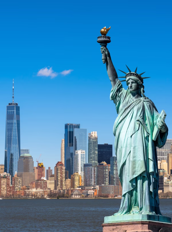Person reviewing documents for USA visit visa from Dubai requirements with a U.S. embassy building in the background.