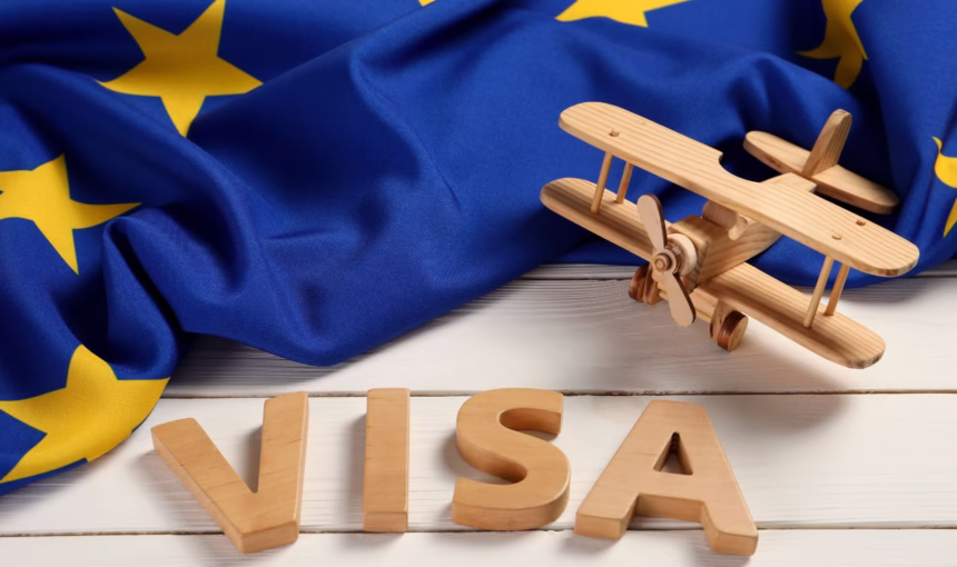 Schengen Visit Visa From Dubai | 5 Tips To Avoid Delay #Easy › Forever Tourism LLC Person holding passport and visa documents – applying for a Schengen visit visa from Dubai with all required documents and requirements.