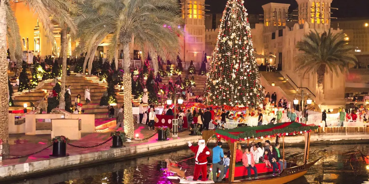Couple enjoying Christmas 2025 in Dubai with the Burj Khalifa in the background, showcasing cheapest Dubai holiday packages and festive December travel.
