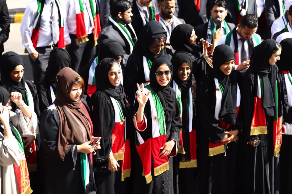 Crowds enjoying UAE National Day 2025 celebrations with fireworks in Dubai, parades in Abu Dhabi, and festive family activities.