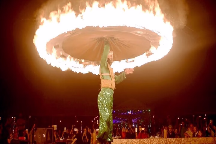 Belly dancer performing at a desert safari in Dubai during sunset – belly dance Dubai desert safari experience.