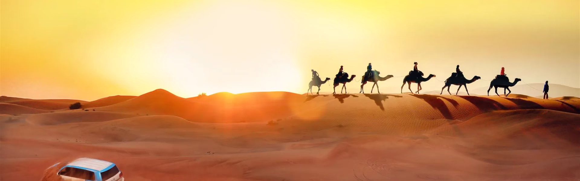 Tourists enjoying a thrilling private desert safari Dubai with dune bashing and scenic views of the Dubai Desert Safari landscape.