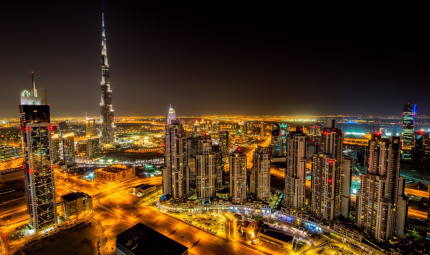 Couple enjoying a sunny winter holiday on a beach during their Dubai holiday 2025, part of a cheap holidays Dubai package.