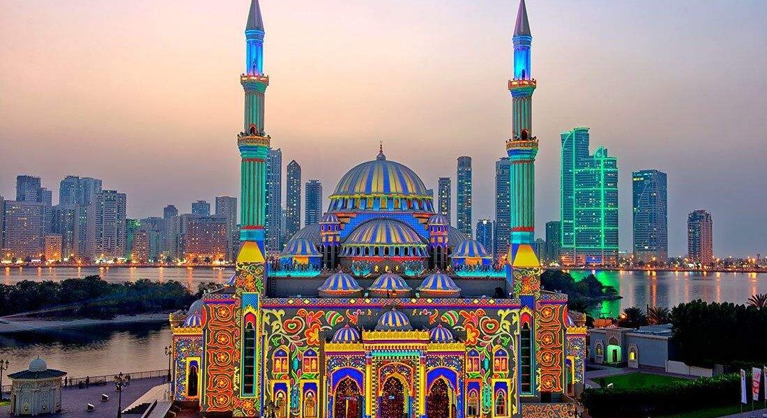 Tourists exploring cultural landmarks during a Sharjah City Tour, capturing the essence of sharjah sightseeing on a guided city tour Sharjah experience.