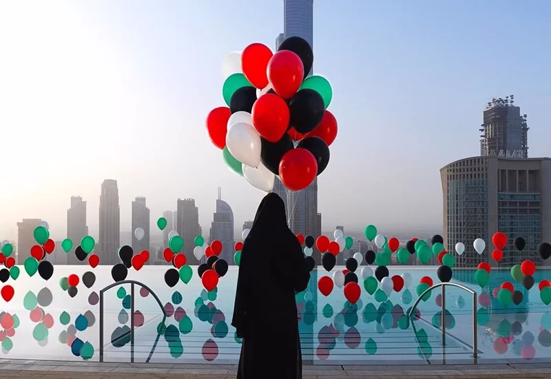 Crowds enjoying UAE National Day 2025 celebrations with fireworks in Dubai, parades in Abu Dhabi, and festive family activities.
