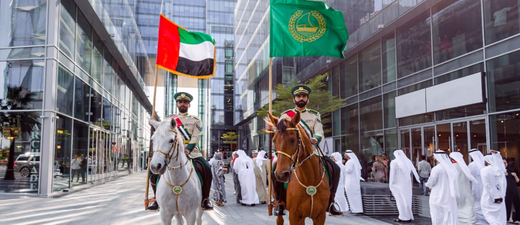 Crowds enjoying UAE National Day 2025 celebrations with fireworks in Dubai, parades in Abu Dhabi, and festive family activities.
