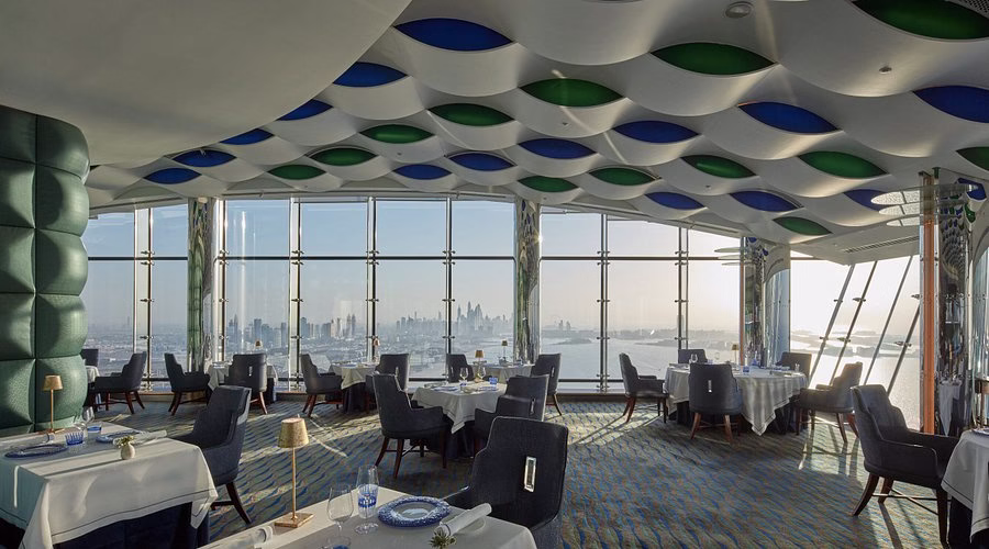 Panoramic view of Burj Al Arab, one of the best hotels in Dubai, showcasing its iconic architecture and luxurious interiors.