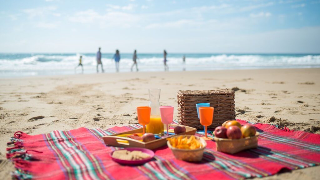 Picnic setup by the beach with skyline view at top Picnic Locations in Abu Dhabi