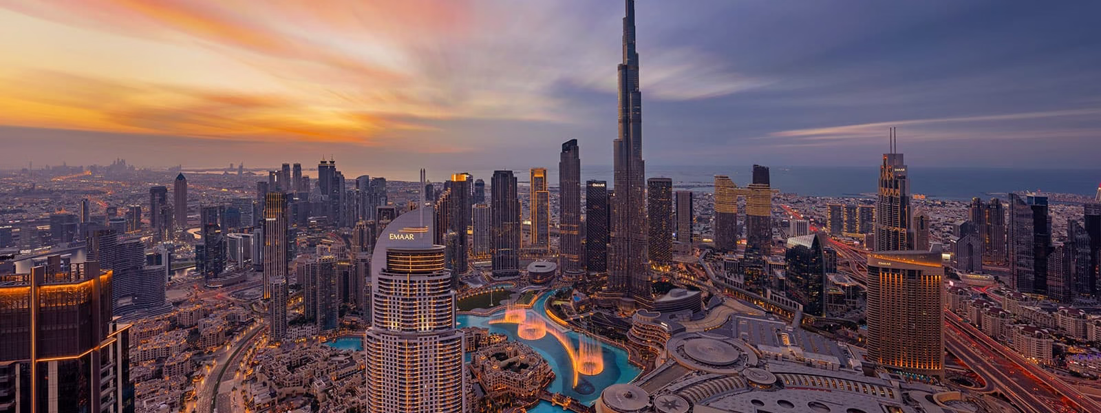 Not Worth It? 4 Dubai Hop On Hop Off Bus Tips | #SmartRoute › Forever Tourism LLC Dubai hop on hop off bus passing iconic landmarks during a Dubai sightseeing city tour.