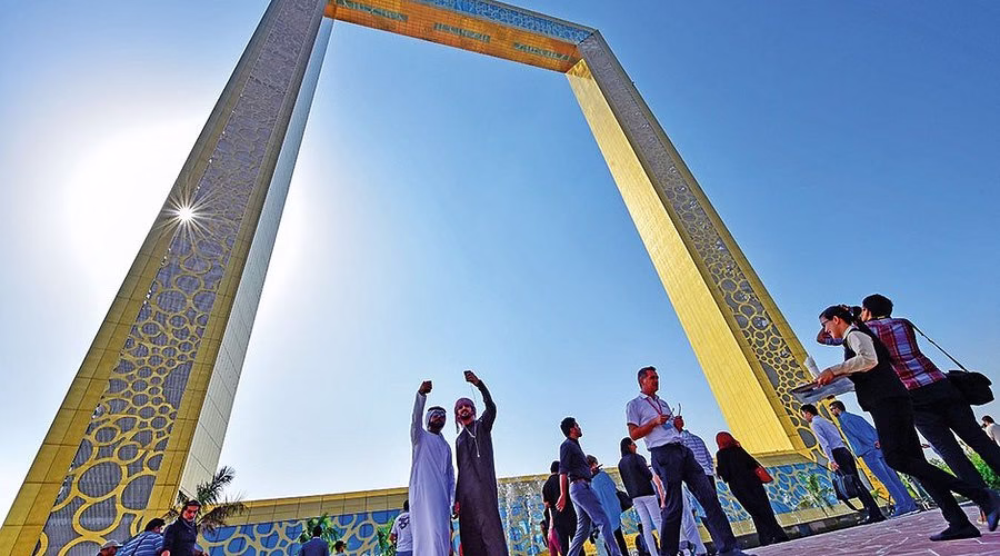 Visitors enjoying the skyline view from The Frame Dubai with Dubai Frame tickets.