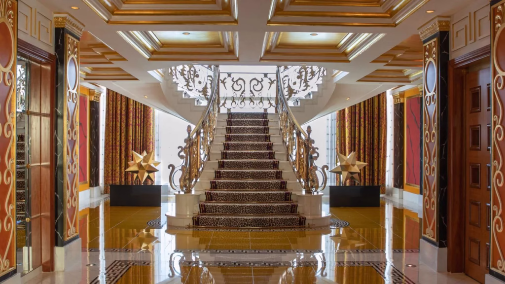 Panoramic view of Burj Al Arab, one of the best hotels in Dubai, showcasing its iconic architecture and luxurious interiors.